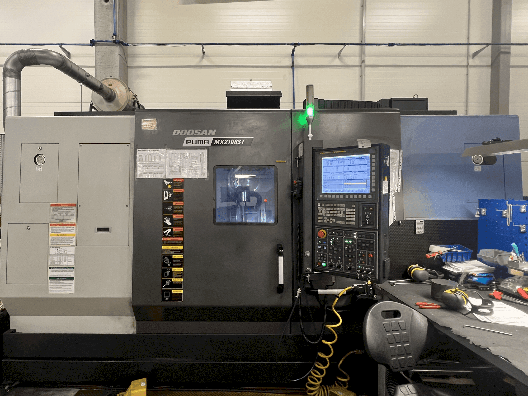Mašīnas DOOSAN MX2100ST pretskats